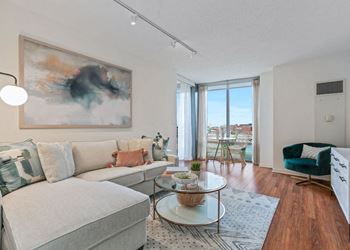 Spacious living room with plank flooring
